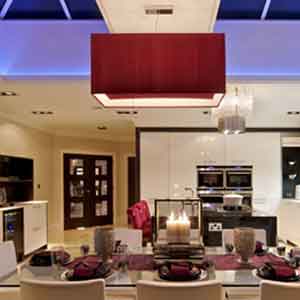 A bespoke red square lampshade shown in a kitchen dining area