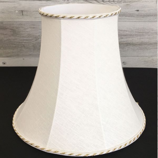 Close up of white and gold bowed empire lampshade