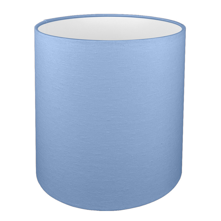 A tall drum lampshade in blue brushed cotton with a white PVC inner lining