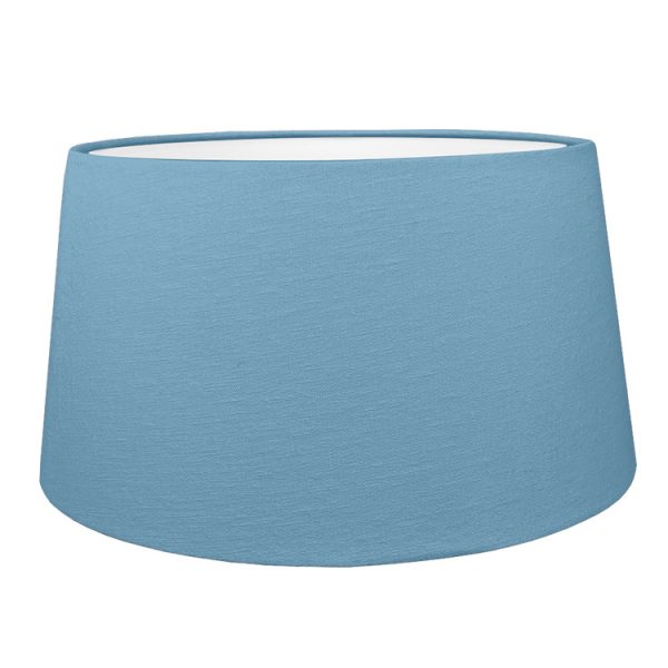 Blue french drum style lampshade shown with the white lining option