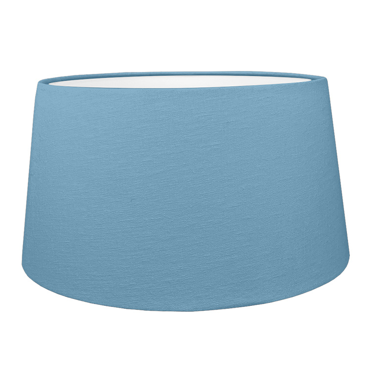 Blue french drum style lampshade shown with the white lining option