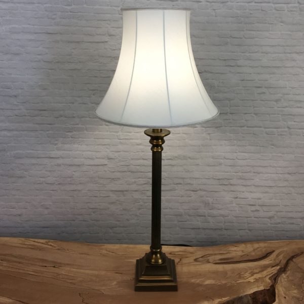 Table Lamp image of our Traditional Bowed Empire Lampshade in Natural Faux Silk with a matching Natural Soutache Trim. Shown Lit Up