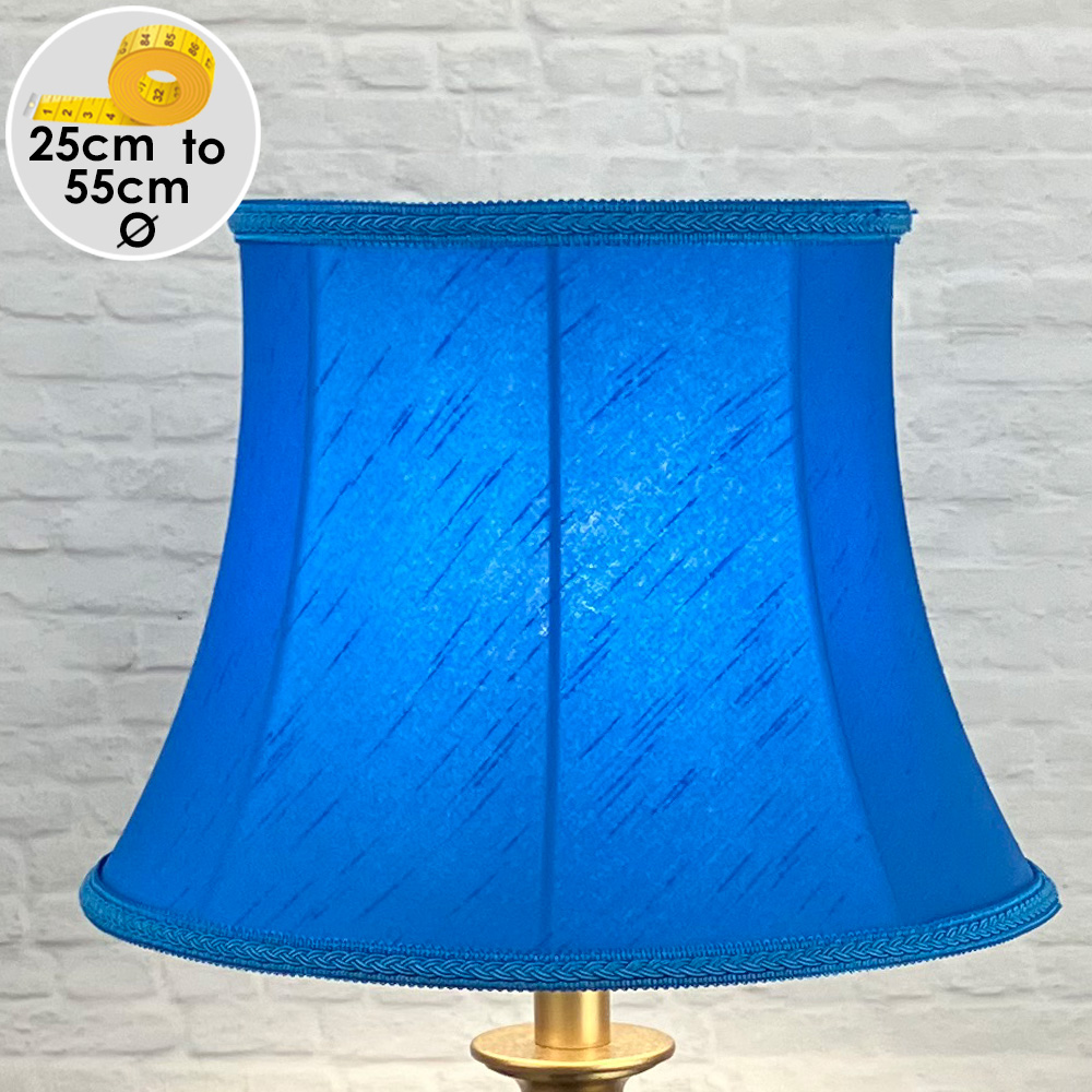 Vibrant Retro Bright Blue Faux silk Lampshade with Matching Plaited Rope, shown as a Table Lamp Lit Up