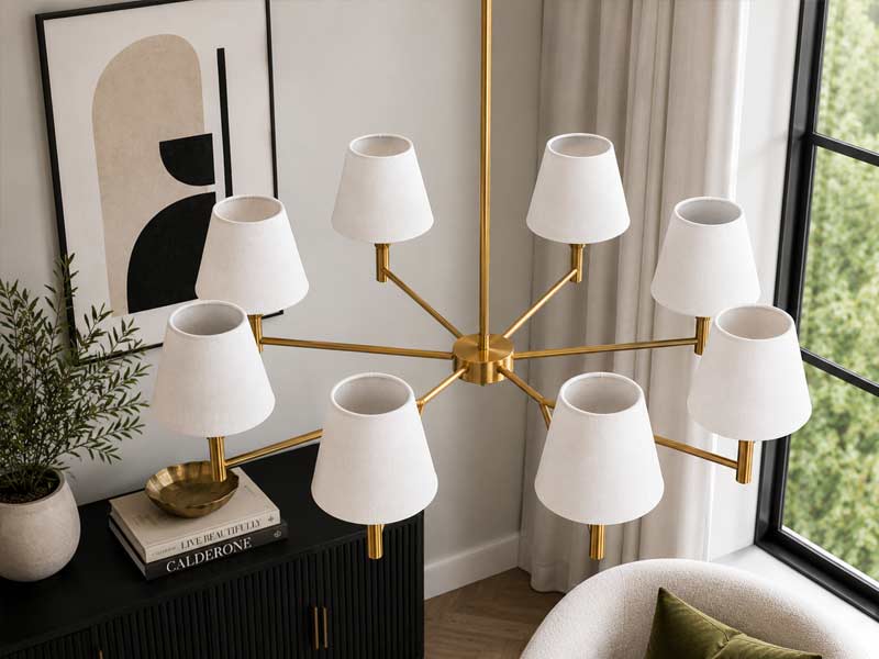Handmade White Empire Clip-On lampshades Handmade white empire clip-on lampshades fitted to a chandelier in a classic interior.