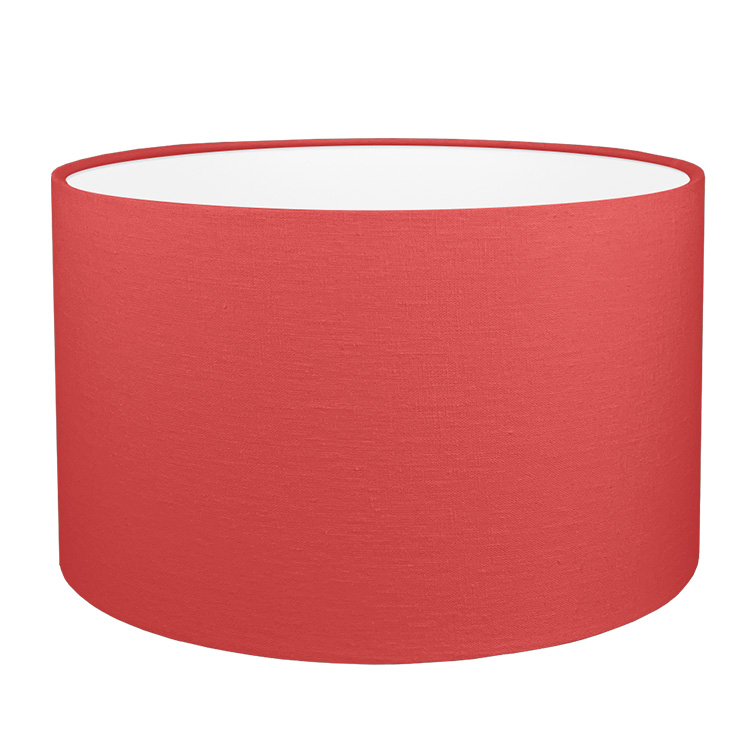 A red brushed cotton drum lampshade with white PVC lining