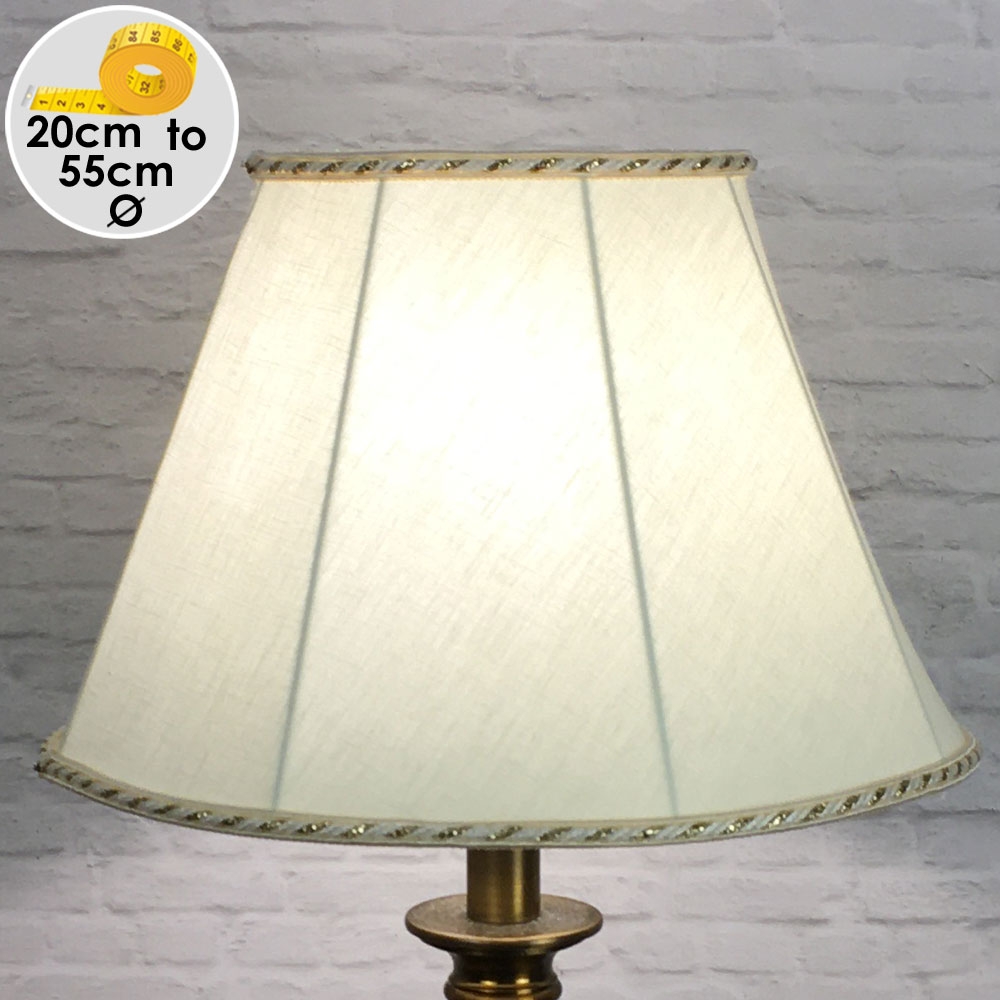 An Empire shaped traditional lampshade in cream cotton with two tone cream and gold rope trim