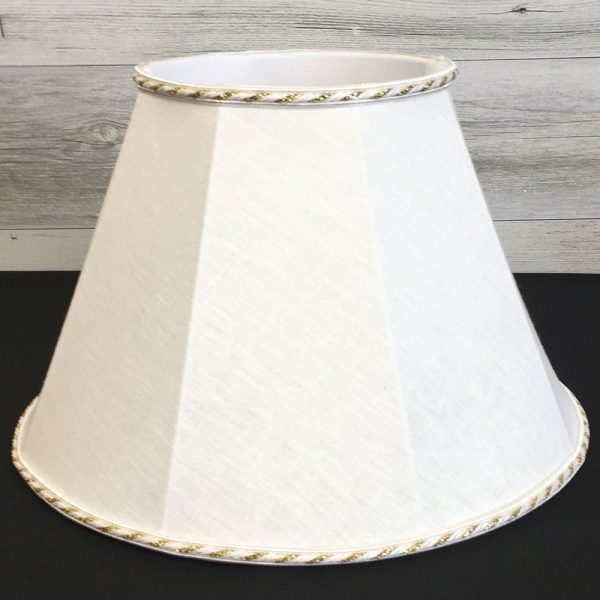 Close up image of our Retro straight sided Empire lampshade in a white brushed cotton with a twisted white and metallic gold rope trim. Showing the soft white balloon lining.