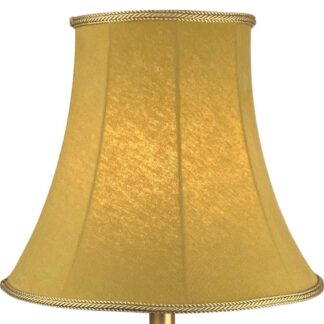 Illuminated old gold brushed cotton bowed empire lampshade with soft textured finish