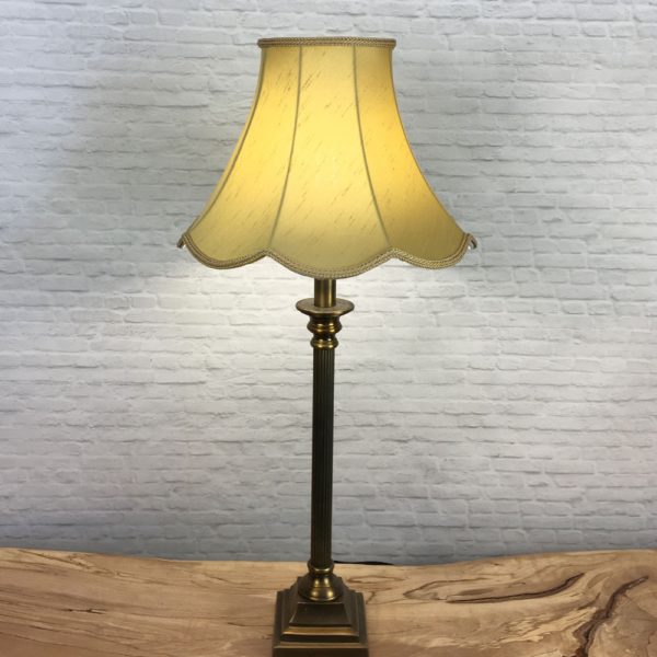 Complete Image of a Retro Old Gold Faux Silk Scalloped Lampshade on a Table lamp switched on