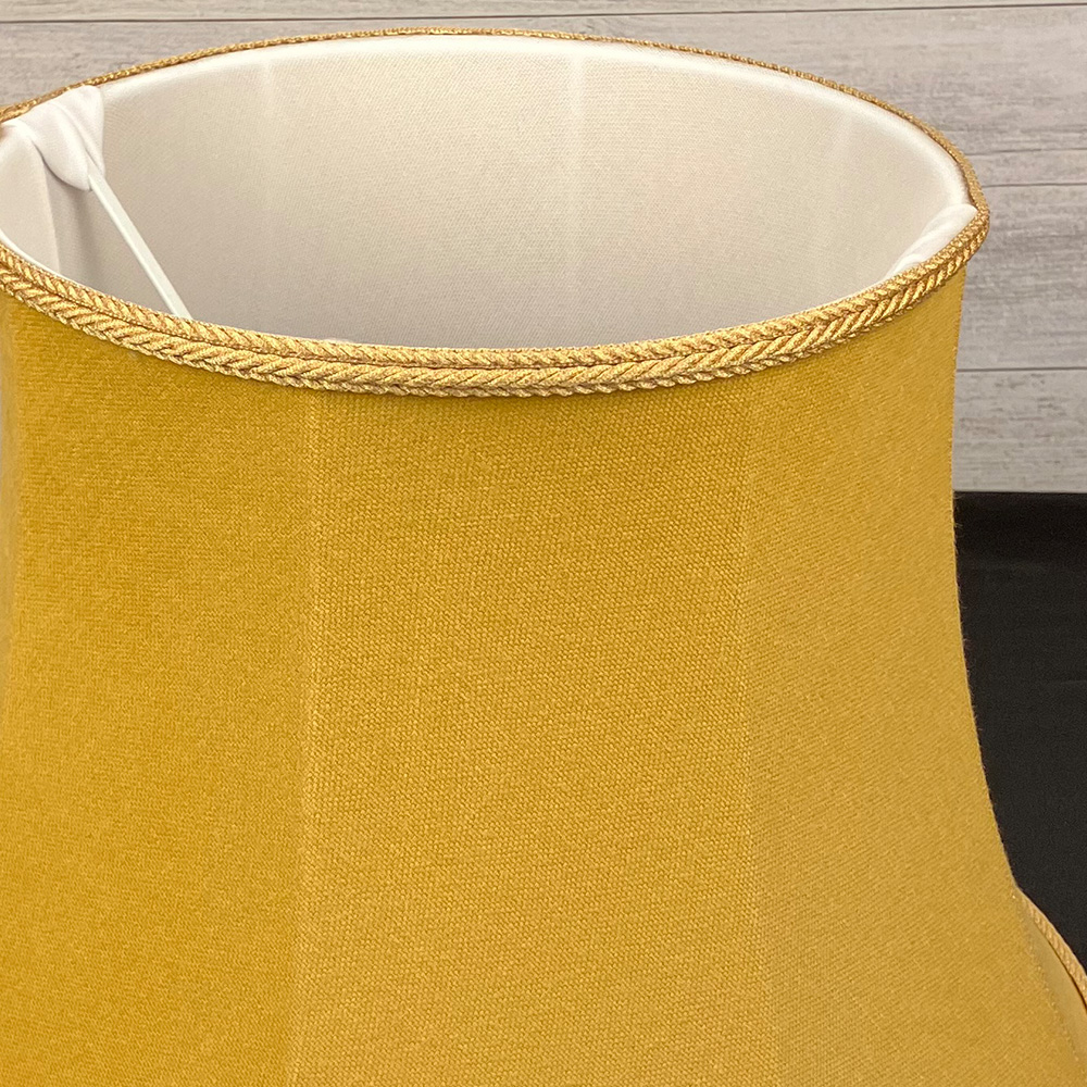 Close up image of a Traditional Old Gold Brushed Cotton Lampshade with a matching Rope Trim, showing the inside soft white lining for Table and Floor Lamps