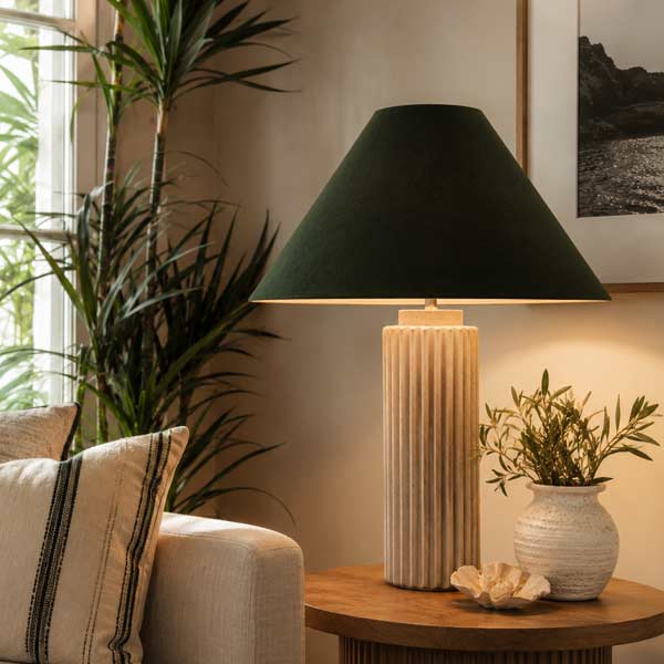 Handmade Dark Green Coolie Lampshade Handmade dark green coolie lampshade on a contemporary table lamp in a modern living room.