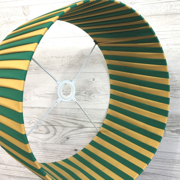 Pleated Lightshade shown on its side in Green and Gold stripe