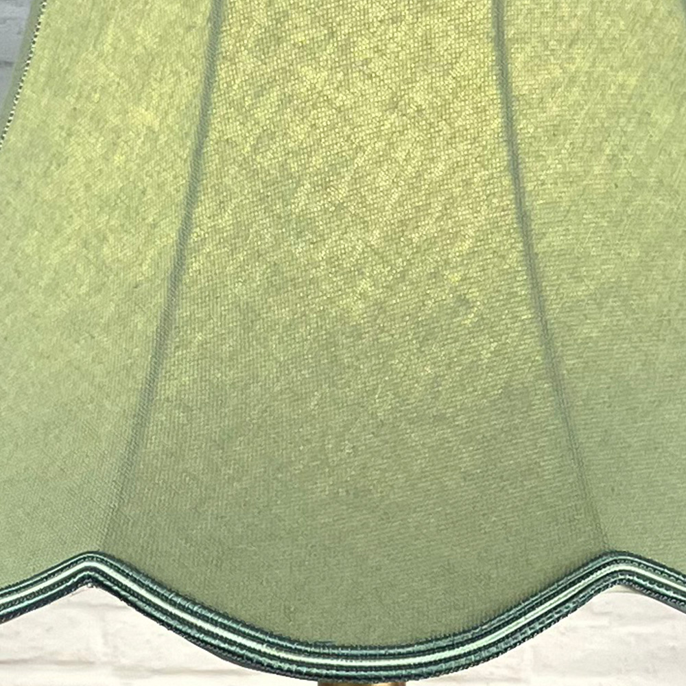 Close Up Image Green Scalloped Lampshade on a Standard lamp