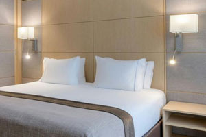Marriot-Hotels A Marriott Hotel bedroom with simple bedside wall light shades