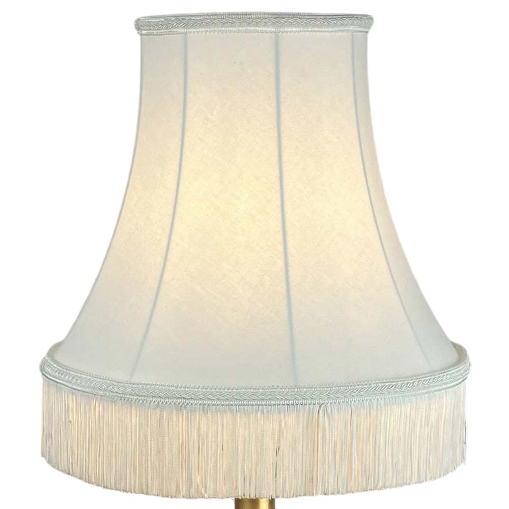 Illuminated natural brushed cotton bowed empire lampshade with decorative fringe trim