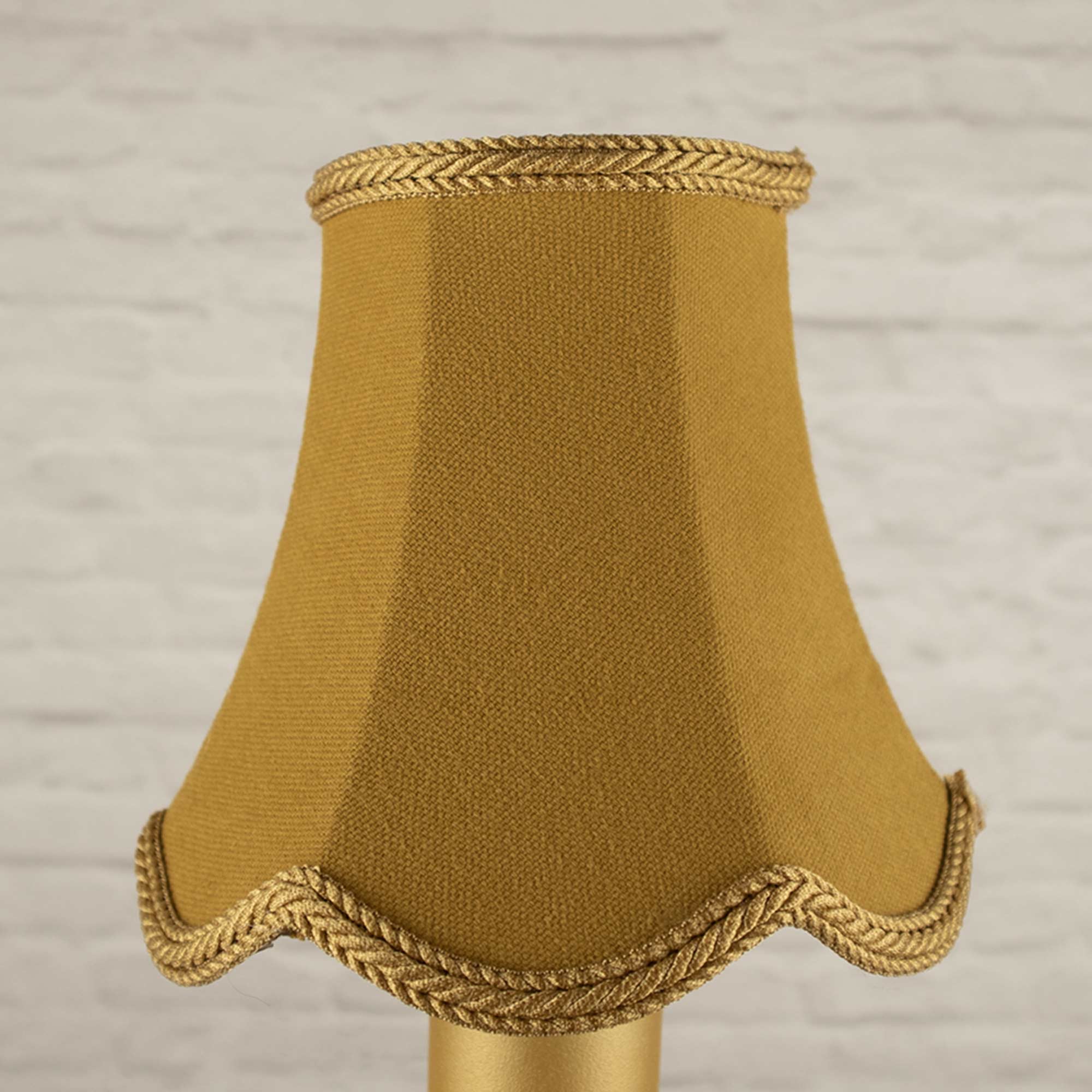 Unlit image of the Old gold brushed cotton scalloped candle shade