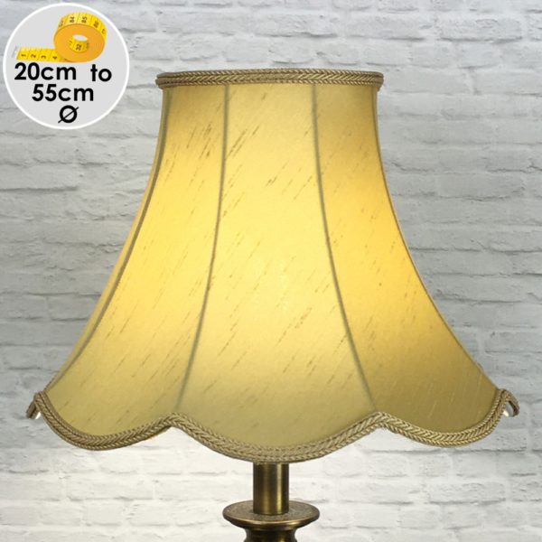 Old Gold Scalloped Faux Silk Lampshade on a Table lamp lit up