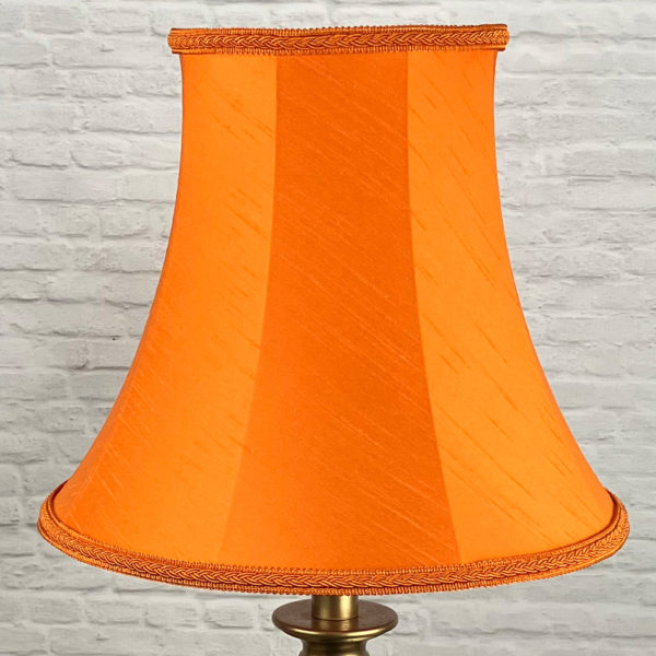 Vibrant Retro Bright Oange Faux Silk Bowed Empire with a matching Plait Trim for a Standard Lamp, switched off