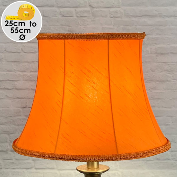 Vibrant Retro Orange Faux silk Lampshade with Matching Plaited Rope, shown as a Table Lamp Lit Up