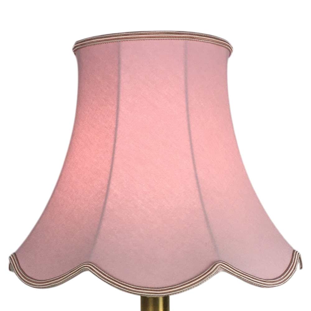 Illuminated pale pink scalloped bowed empire lampshade with decorative scalloped edge