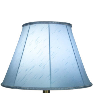 Illuminated pale blue faux silk empire lampshade with pale blue rope trim