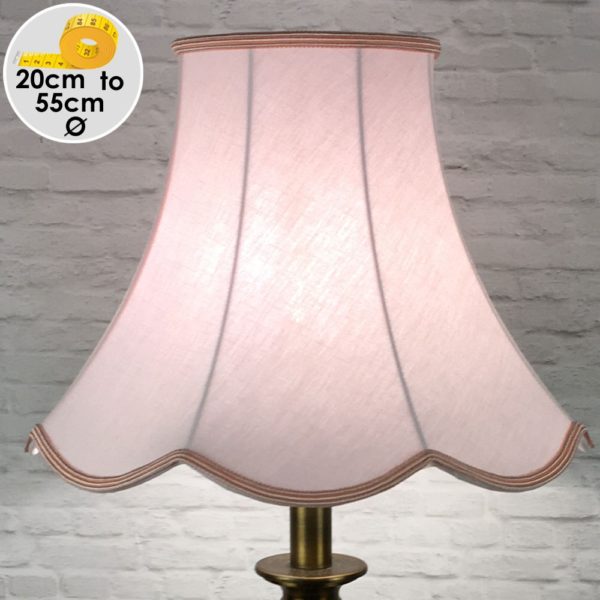 Pale Pink Scalloped Light shade on a Table lamp switched on