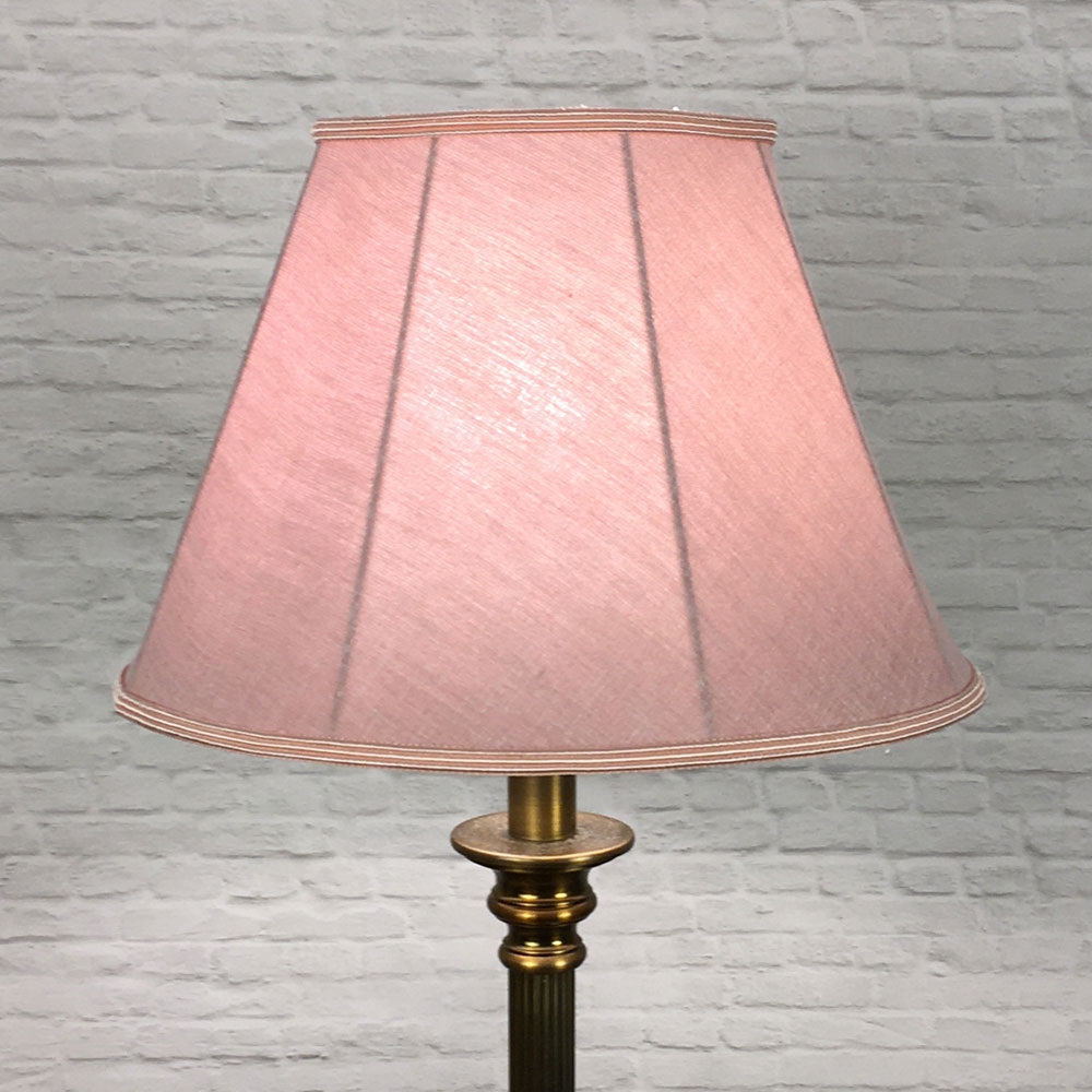 A Traditional table lamp showing our straight sided Empire lampshade in Dusty Rose Linen with a Rose Soutache trim top and bottom. Shown switched on. Suitable for all table, floor and standard lampshades