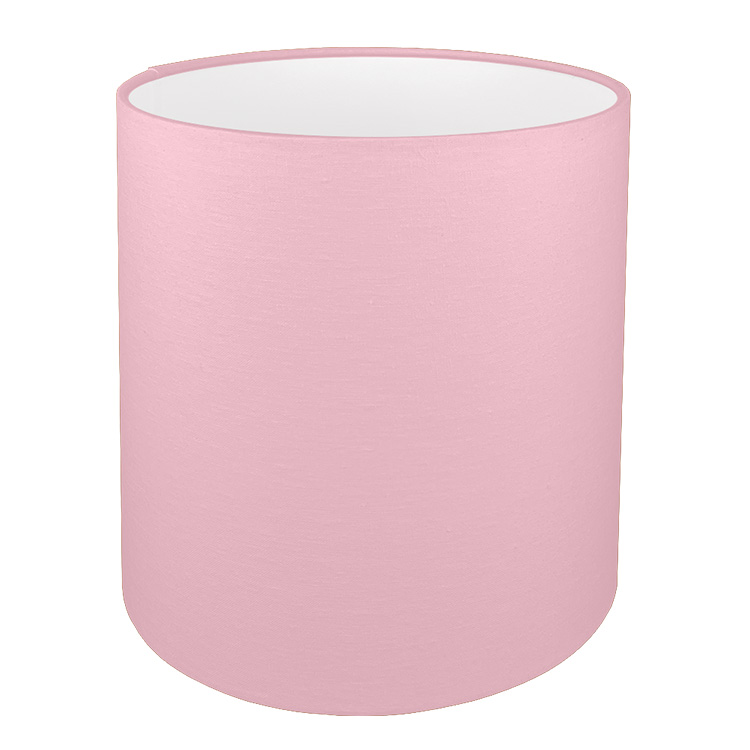 A tall drum lampshade in pink brushed cotton with a white PVC inner lining