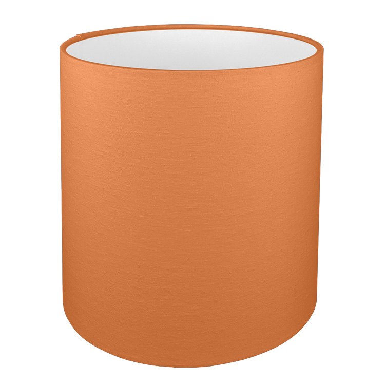 A tall drum lampshade in orange brushed cotton with a white PVC inner lining