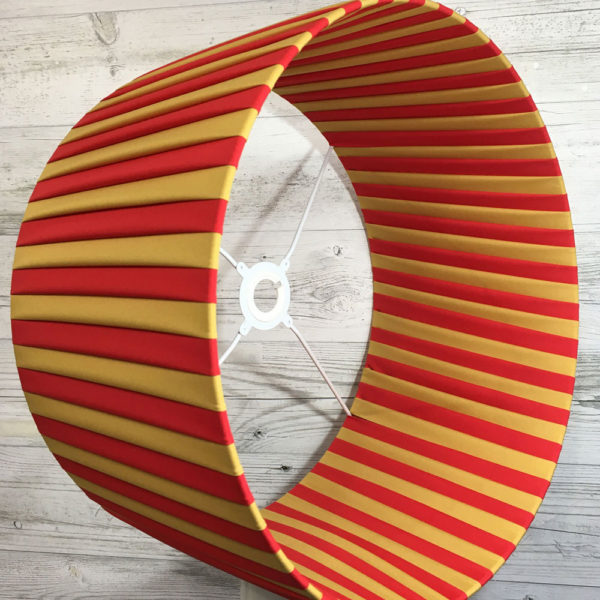 Pleated Lightshade shown on its side in red and gold stripe