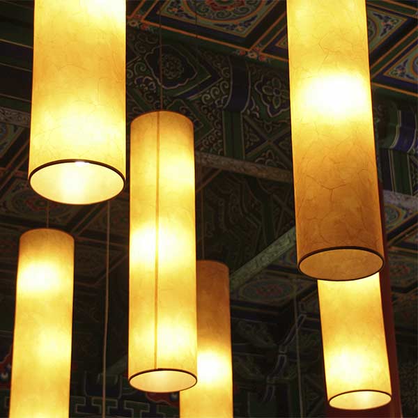 Wholesale Lampshades | Imperial Lighting Custom-made tall cylinder pendant lampshades installed in a commercial hospitality interior for a wholesale lampshade project.