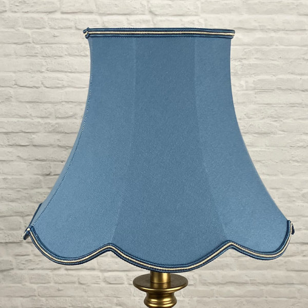 Blue Scalloped Lampshade on a Floor lamp switched off