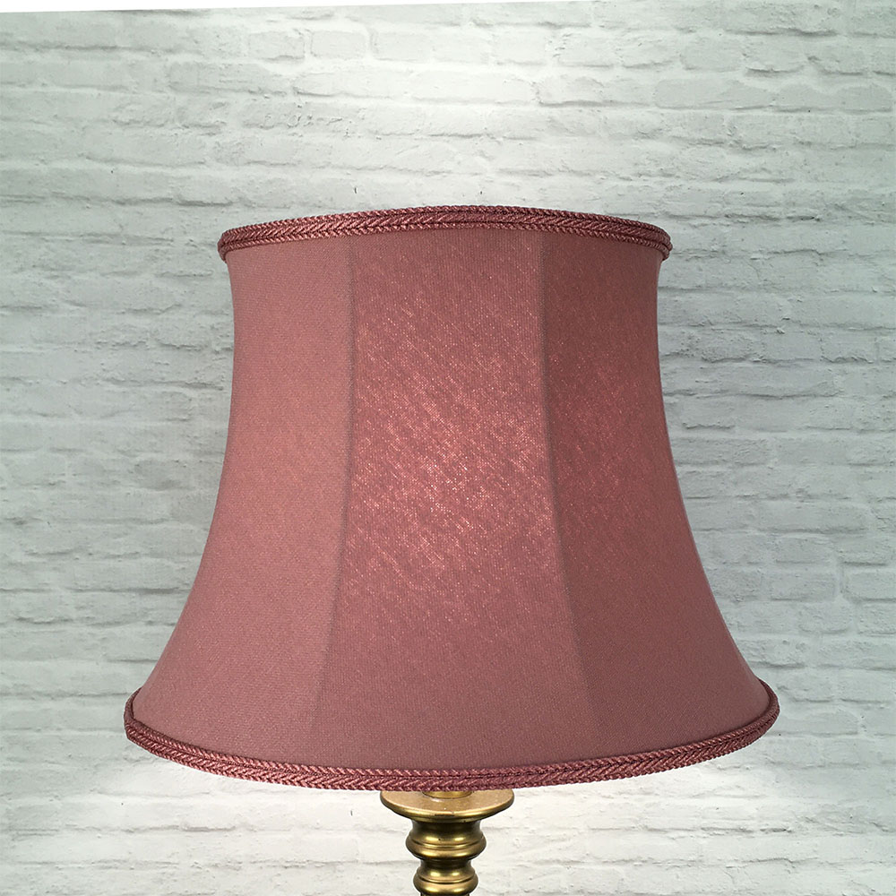 Illuminated Bon Bon pink brushed cotton bowed drum lampshade with warm ambient glow