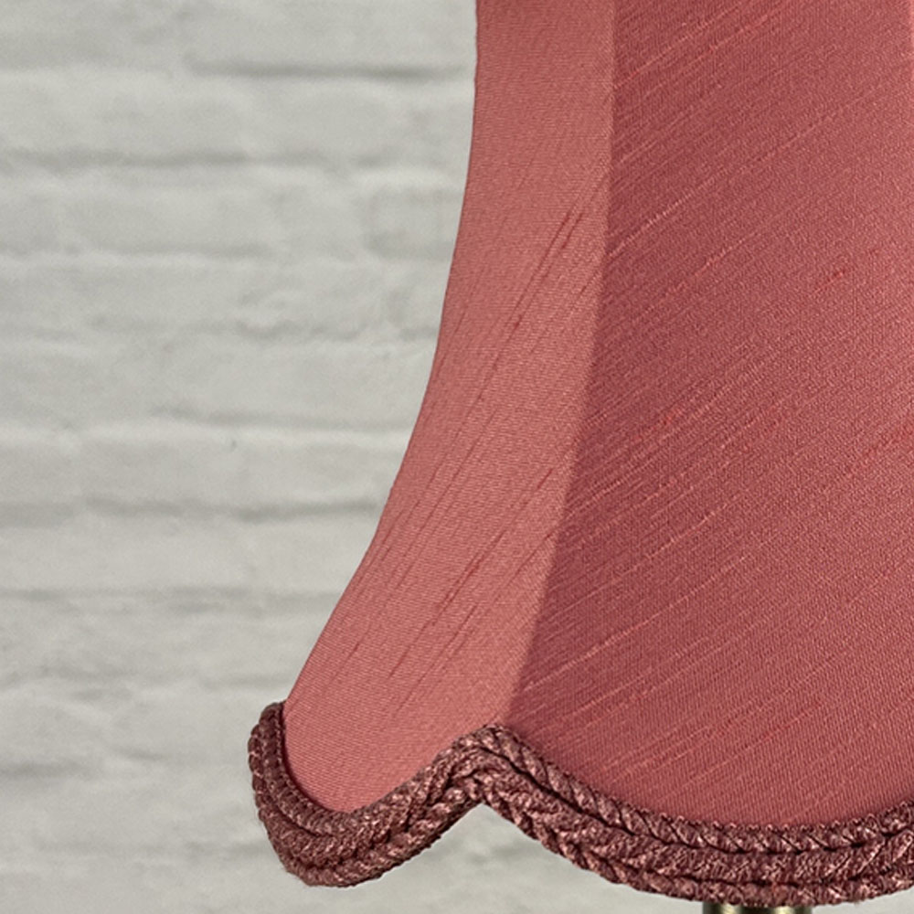 Close-up of bon bon faux silk scalloped chandelier shade with plait trim