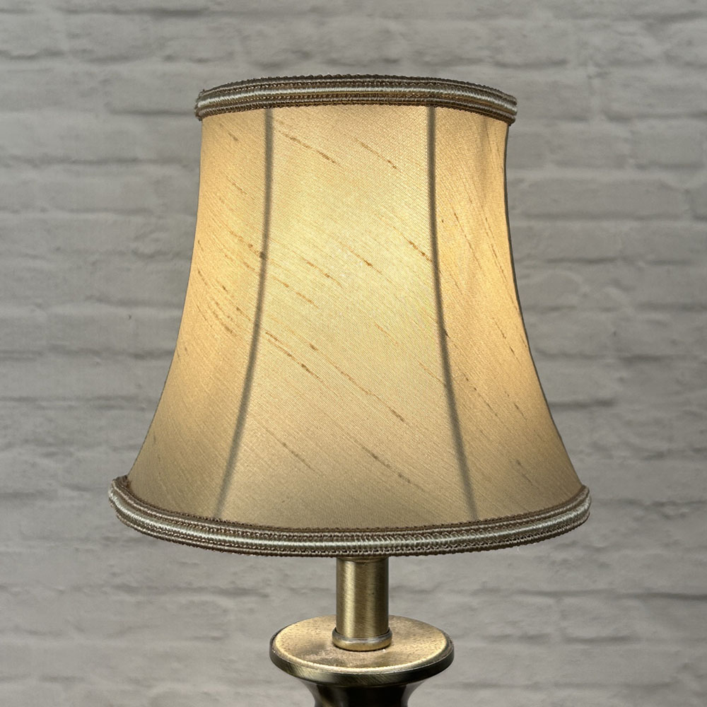 Fawn bowed chandelier shade in faux silk lit showing warm neutral tone