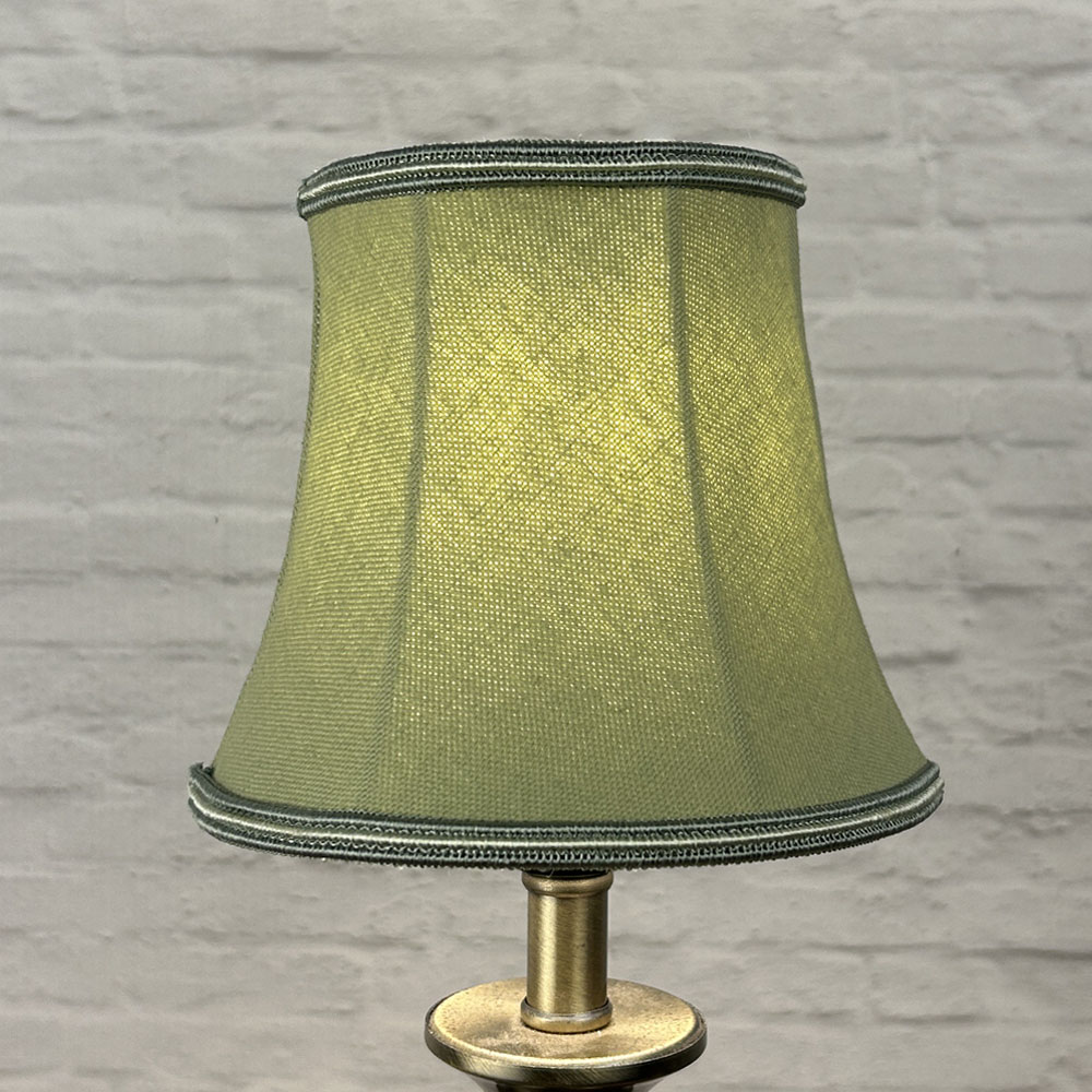 Pear bowed chandelier shade in brushed cotton lit showing soft tone and green and oyster soutache trim