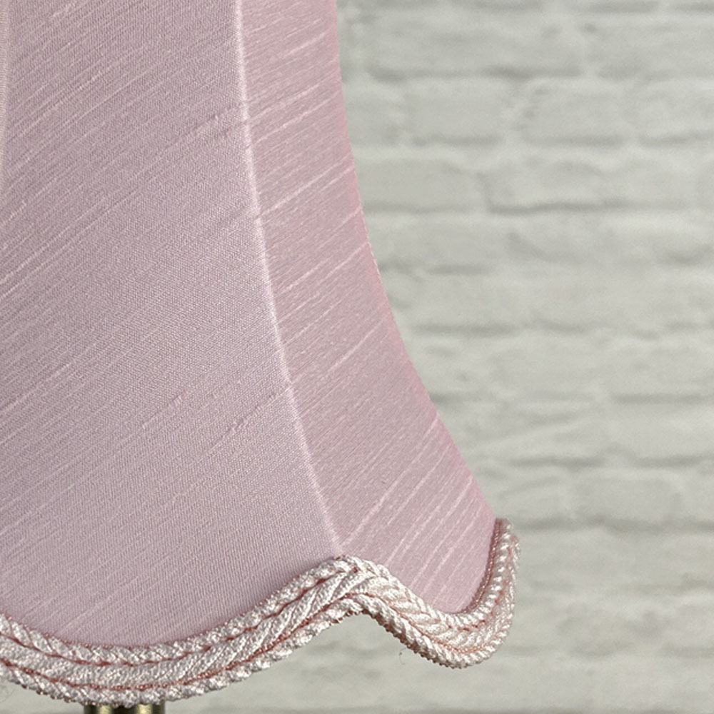Close-up of pale pink faux silk scalloped chandelier shade with rope trim