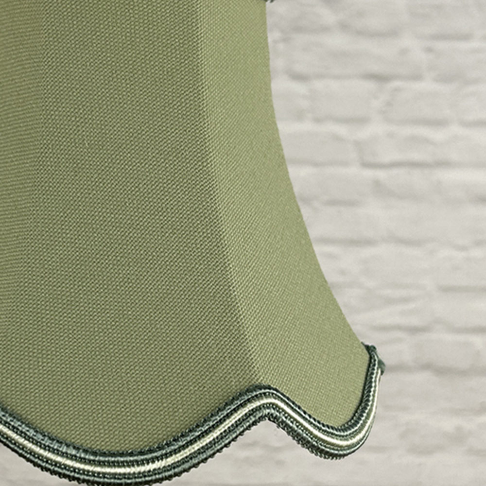 Close-up of pear brushed cotton scalloped chandelier shade with green and oyster soutache trim