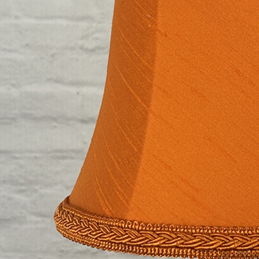 Close-up of pumpkin faux silk bowed chandelier shade