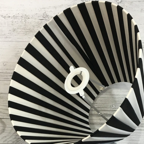 Cream and Black Pleated Lightshade shown on its side