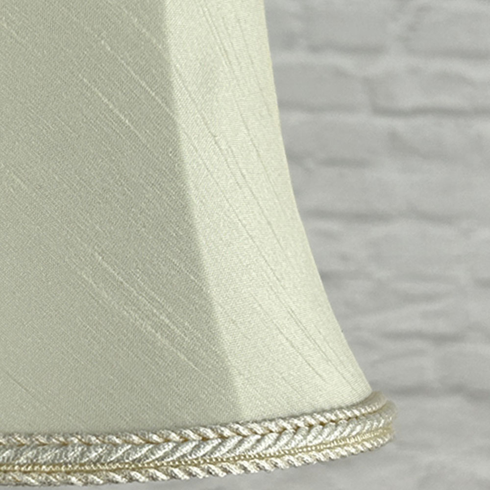 Close-up of cream faux silk bowed chandelier shade with rope trim