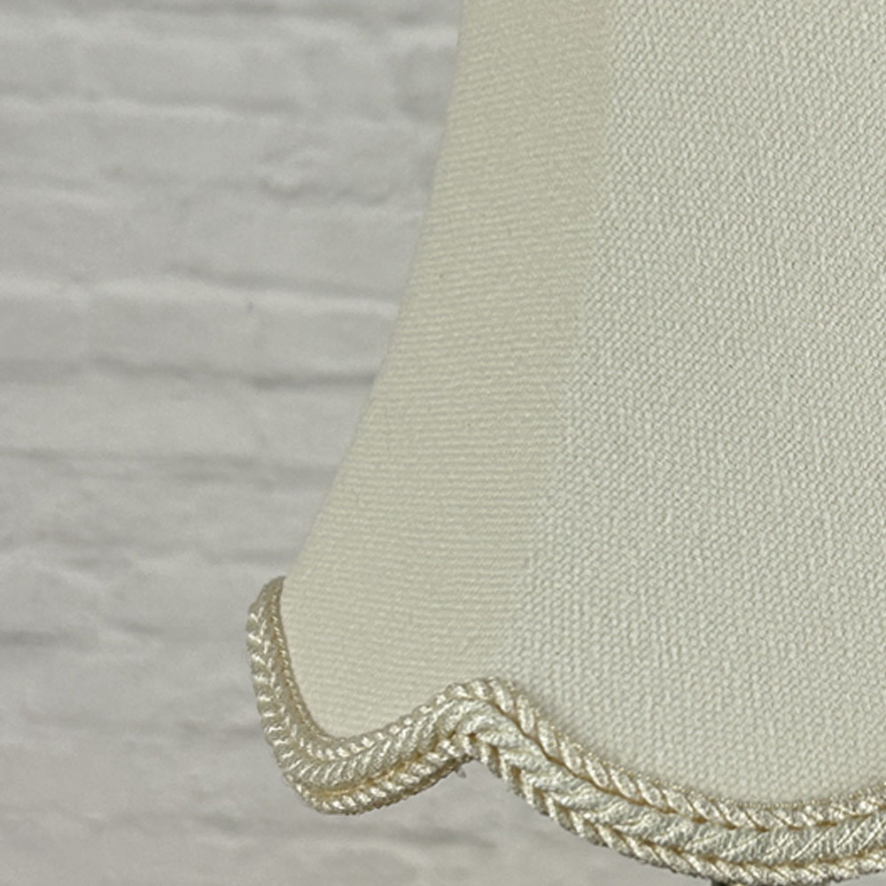 Close-up of cream brushed cotton scalloped chandelier shade with rope trim