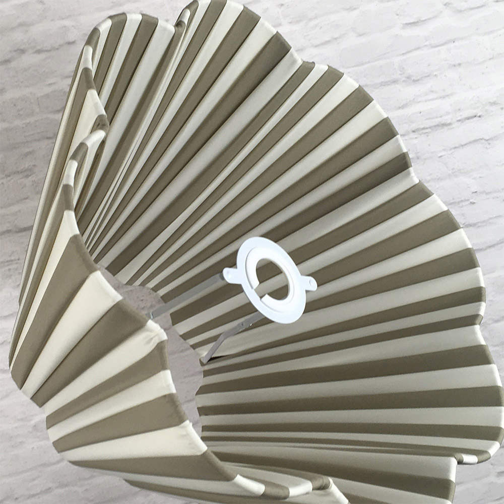 Cream and Taupe striped daisy pleated lampshade styled in an interior setting