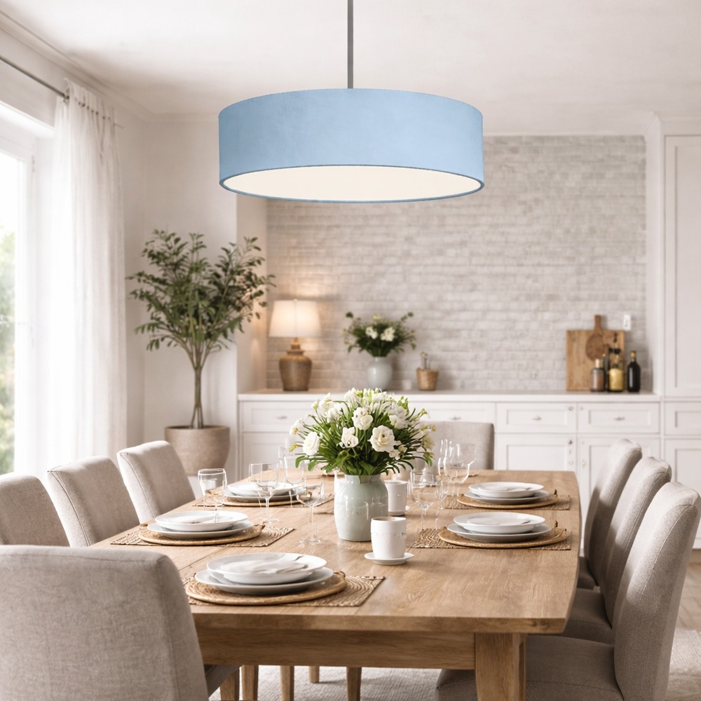 Extra Large blue drum pendant lampshade hanging above a wooden dining table in a modern dining room