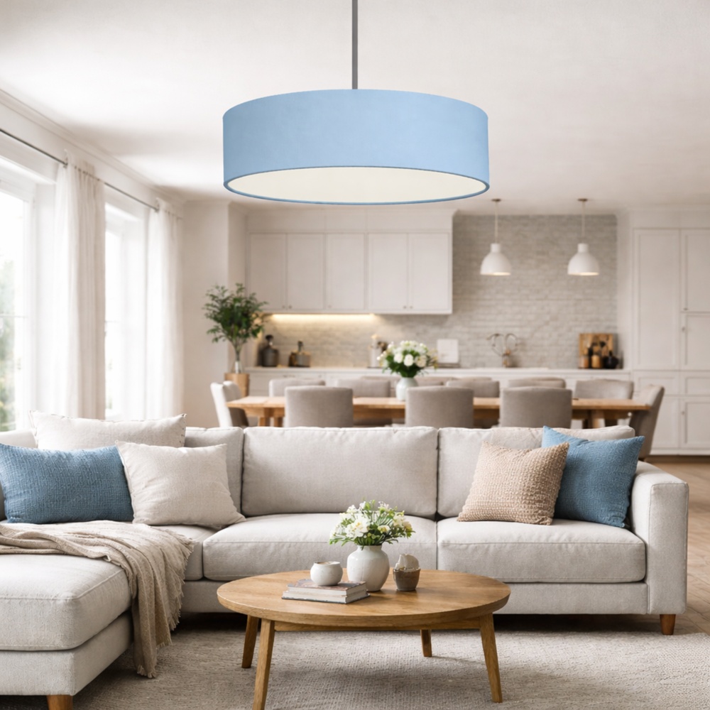Blue drum pendant lampshade in a bright open plan living and dining area