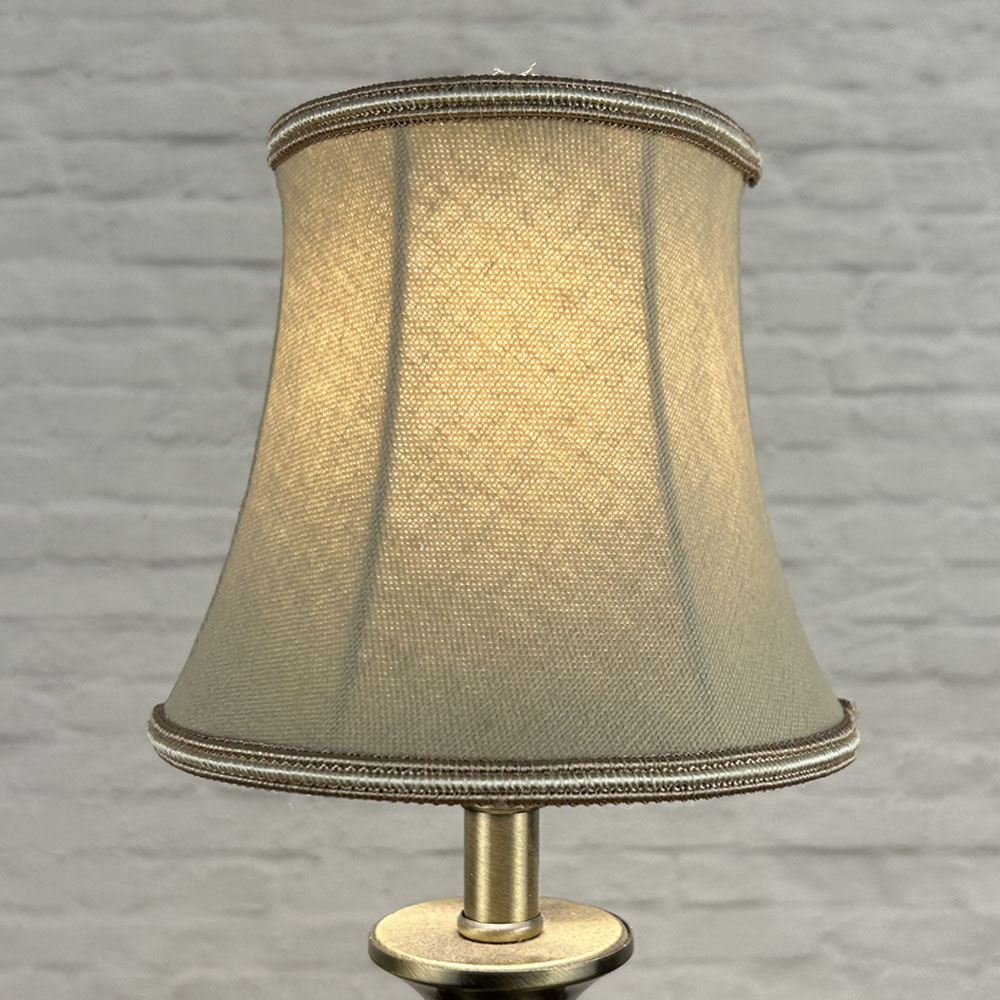 Fawn bowed chandelier shade in brushed cotton lit showing soft neutral tone and oyster soutache trim