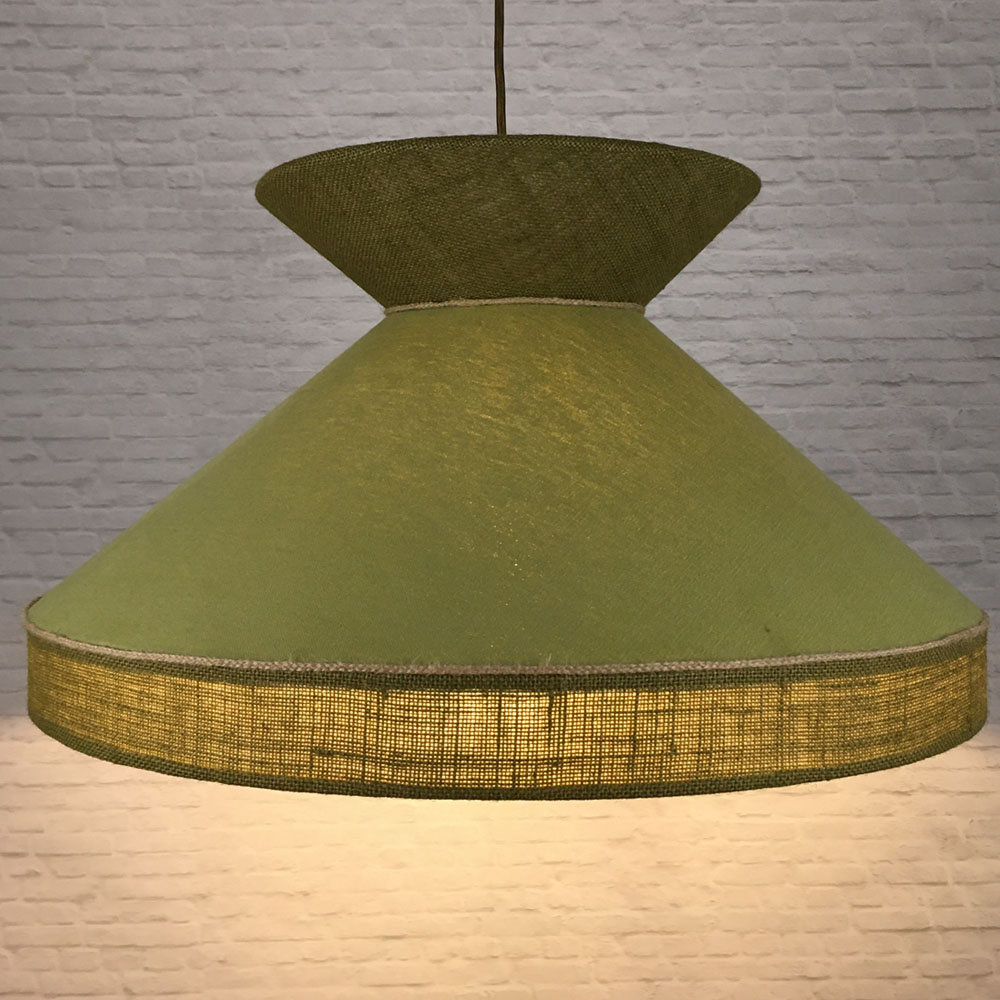 Pear & Olive designer hessian lampshade illuminated to show its warm ambient glow.