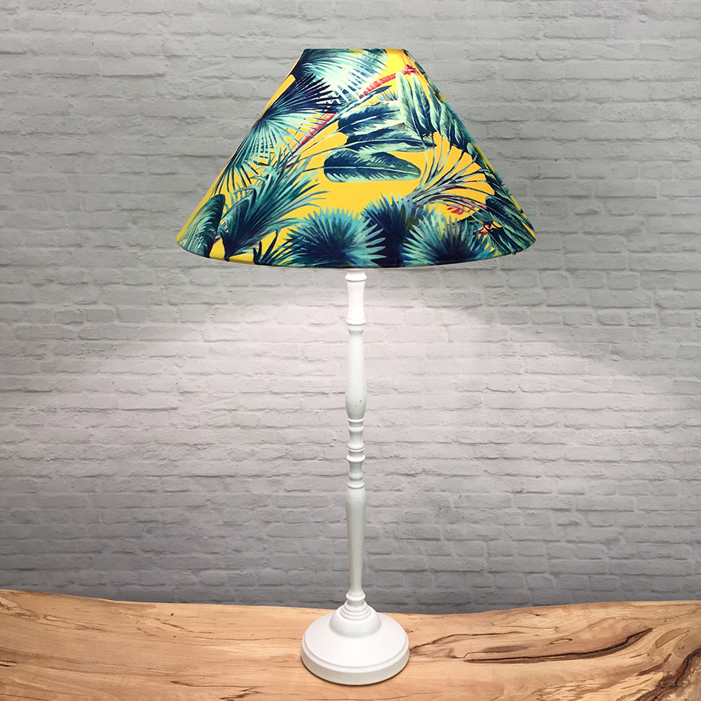Yellow tropical Coolie lampshade on tall table lamp