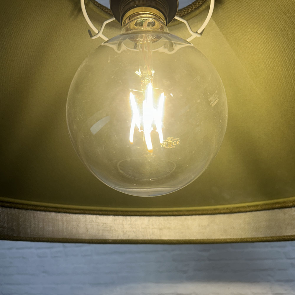 Interior lining and natural woven cord trim detail of the Pear & Olive designer hessian lampshade.