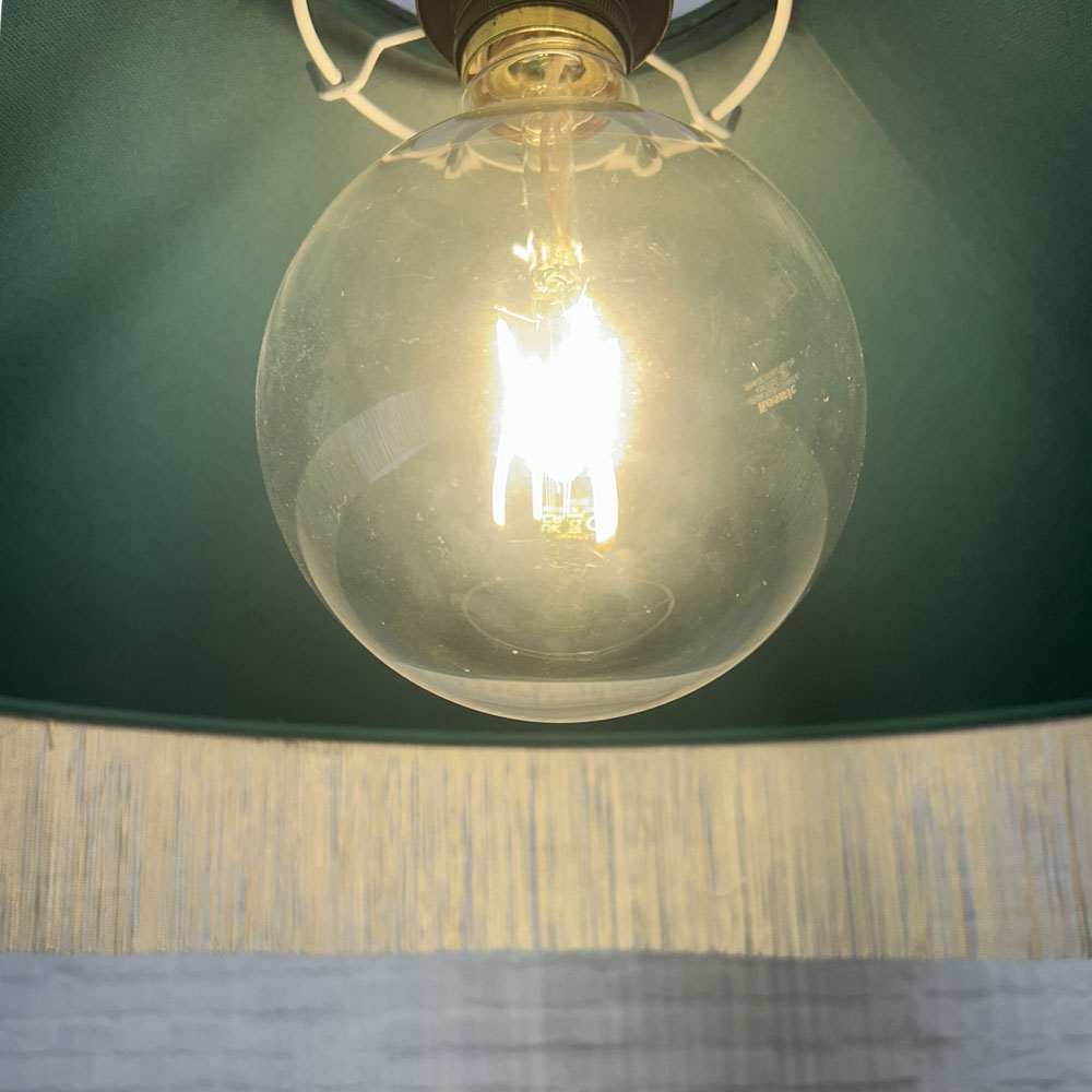 Internal clear PVC lining inside the Teal & Oyster fringe lampshade.